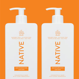 Person applying Native Pumpkin Spice Latte lotion to arms in cozy fall setting for long-lasting softness benefit
