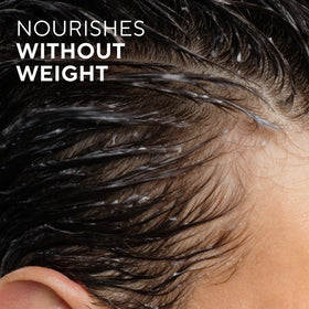 Native in-shower wet hair with lather demonstrating gentle cleansing benefit
