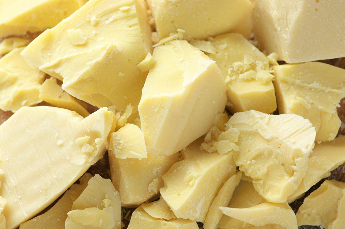 Natural Farms cocoa butter front view showing whole 1 lb block and texture, highlights natural aroma