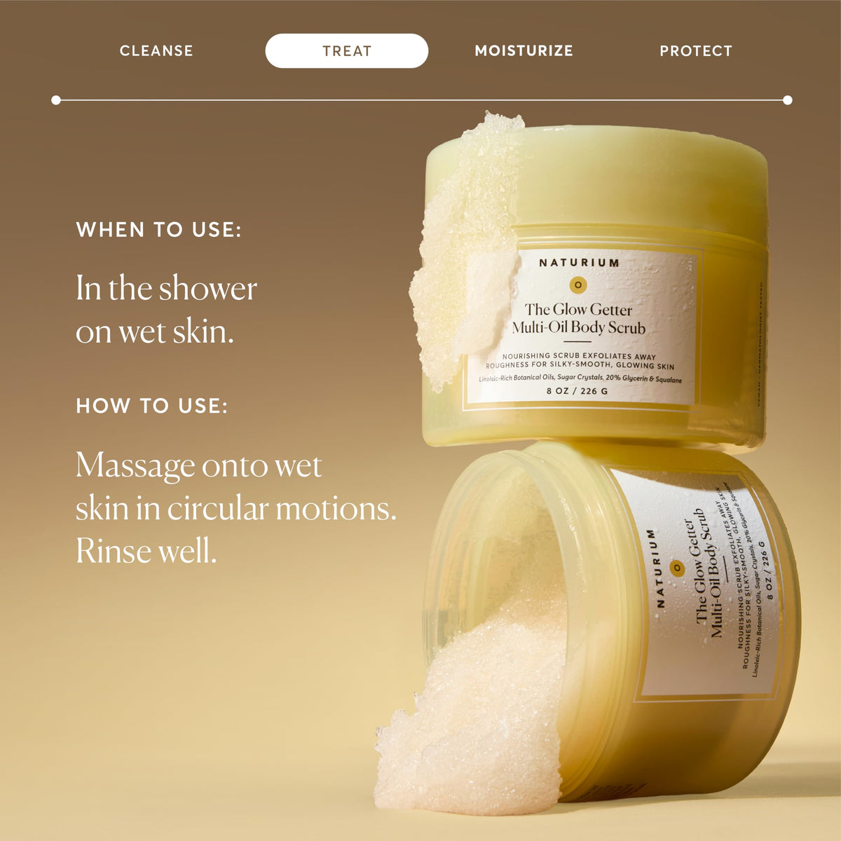 Naturium scrub placed on shower shelf in bath setting demonstrating in-shower use convenience