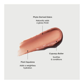 Naturium Phyto-Glow applied on lips in lifestyle shot for visible dewy shine