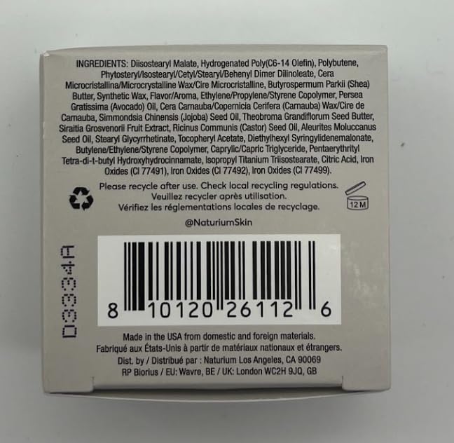 Naturium Phyto-Glow Lip Mask on bathroom vanity styled for nightly skincare ritual and calm