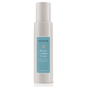 Lifestyle shot of Naturium retinol cream on bathroom shelf conveying daily routine inclusion