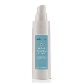 Size comparison of Naturium 1.7 oz retinol cream next to common items showing travel-friendly volume