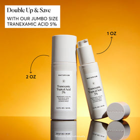 Naturium ingredient flatlay with tranexamic, kojic, niacinamide and licorice extracts