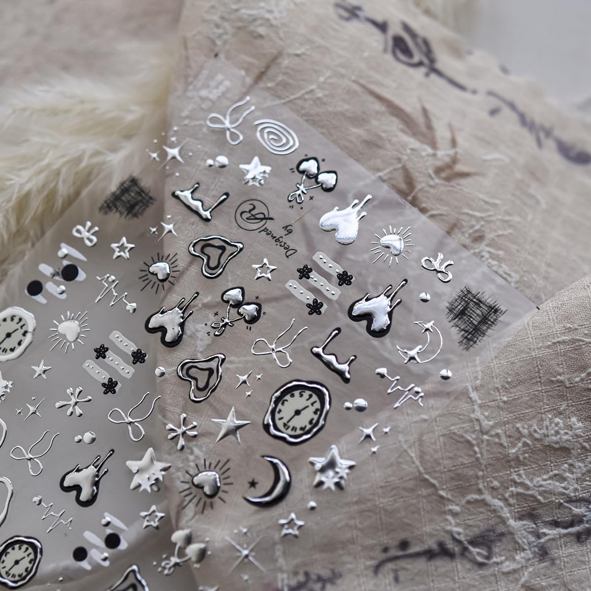 NBNTGH star and clock accents displayed for layered Y2K nail looks