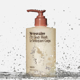 Nécessaire pump close-up highlighting easy dispensing benefit: convenient one-handed use