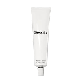 Nécessaire front tube view showing compact travel-ready packaging and benefits