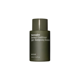Nécessaire front bottle showing sleek label and rosemary fragrance benefit