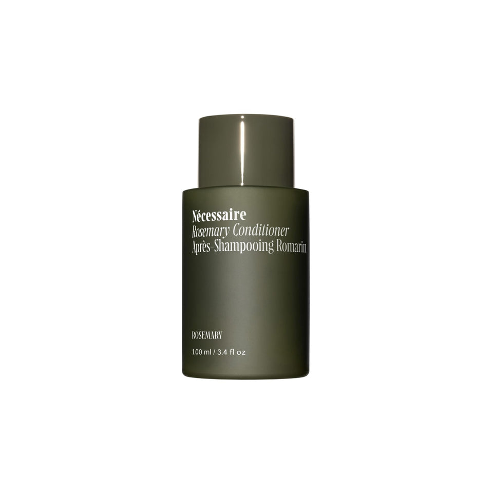 Nécessaire front bottle showing sleek label and rosemary fragrance benefit