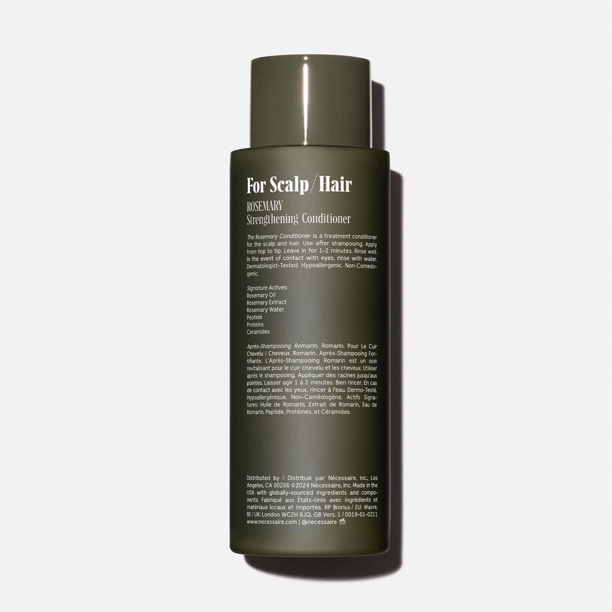 Nécessaire label and pump detail highlighting product clarity and ease of use