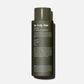 Nécessaire label and pump detail highlighting product clarity and ease of use