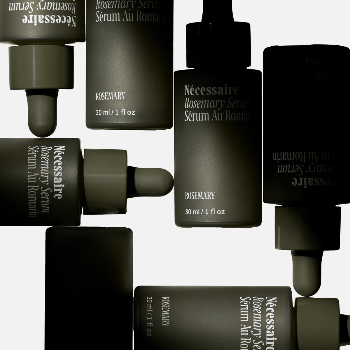 Nécessaire dropper dispensing clear serum highlighting precise application and no residue
