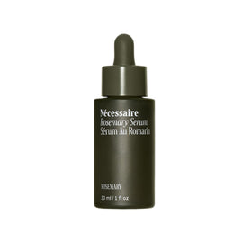 Nécessaire bottle front view showing compact 30ml serum packaging and quick-dry benefit