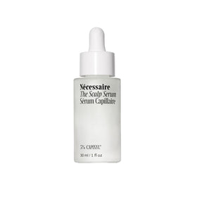 Nécessaire scalp serum front packaging showing the recyclable glass bottle and product name, communicates clean care