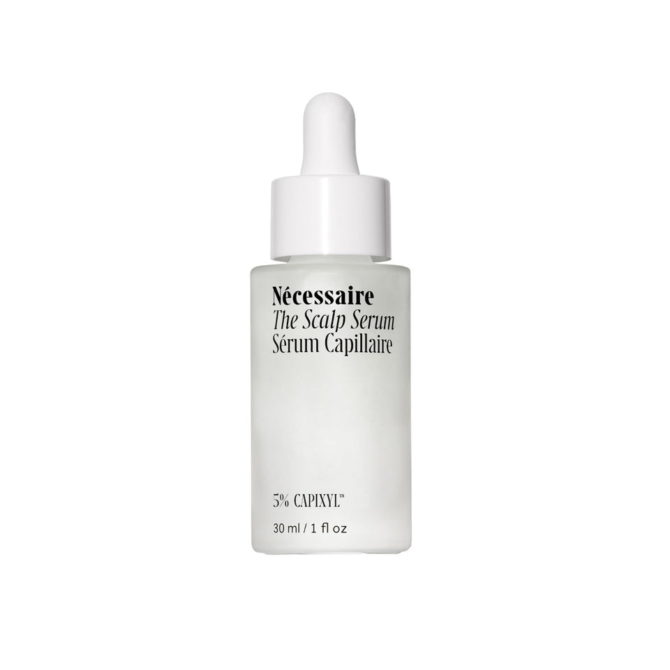 Nécessaire scalp serum front packaging showing the recyclable glass bottle and product name, communicates clean care