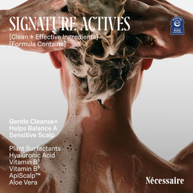 Nécessaire shampoo lathering on hair in shower demonstrating gentle cleansing