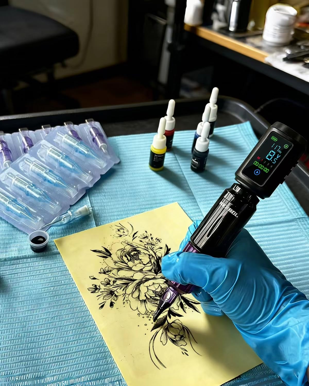 Neebol pen held in hand to show scale and comfortable handling during sessions