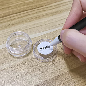 NEEMORE jar beside coin for scale showing compact travel-friendly size