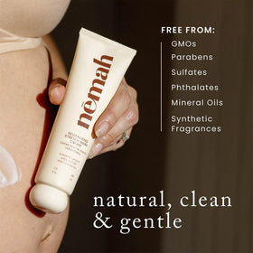 Nemah 3.4 oz cream next to hand for scale showing travel-friendly size