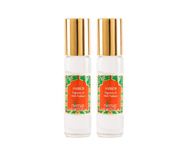 Nemat International front packaging showing two amber roll-on bottles and elegant glass