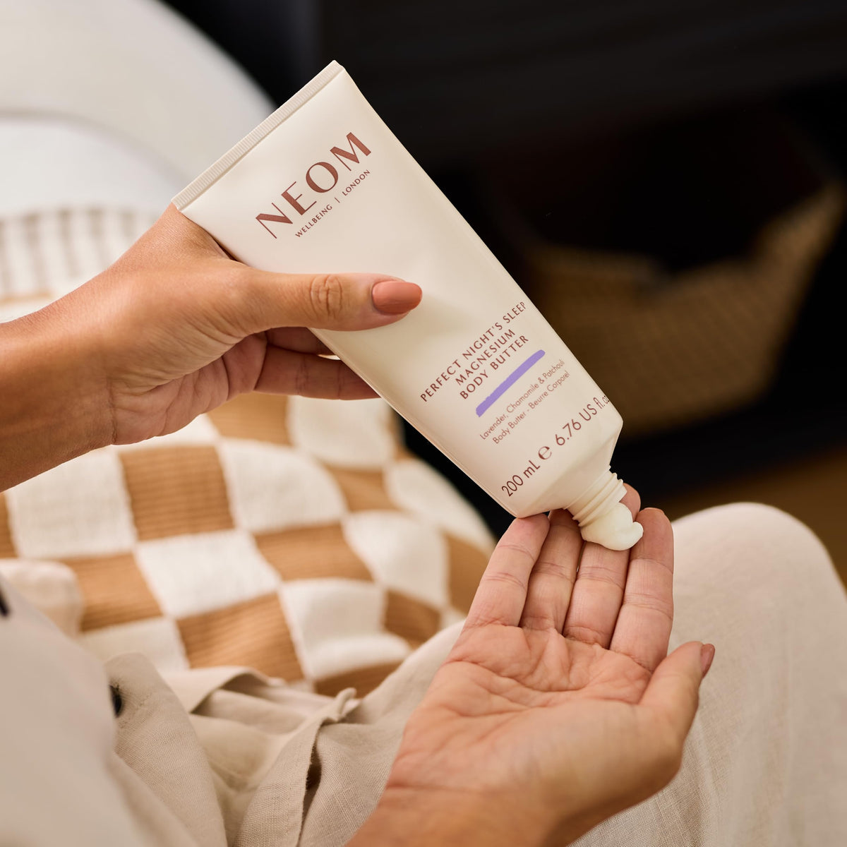 Neom application on hands demonstrating easy absorption and moisturising