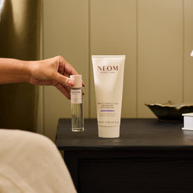 Neom jar on bathroom shelf in lifestyle setting promoting relaxing routine