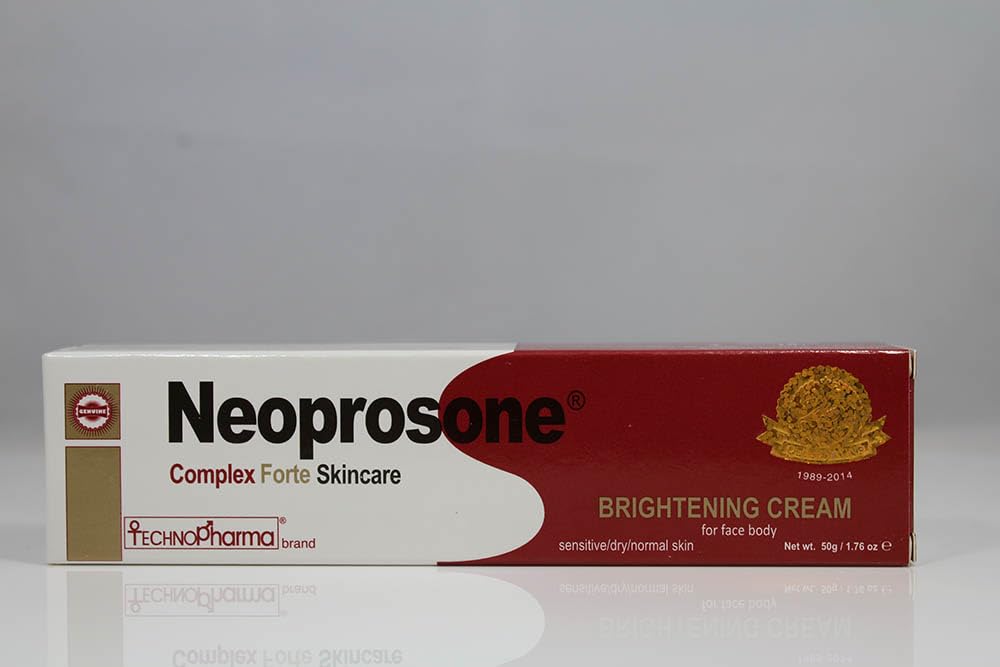 Neoprosone next to coin for scale showing compact 50 ml size