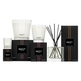NEST New York bottle beside common object to show compact 10 fl oz size