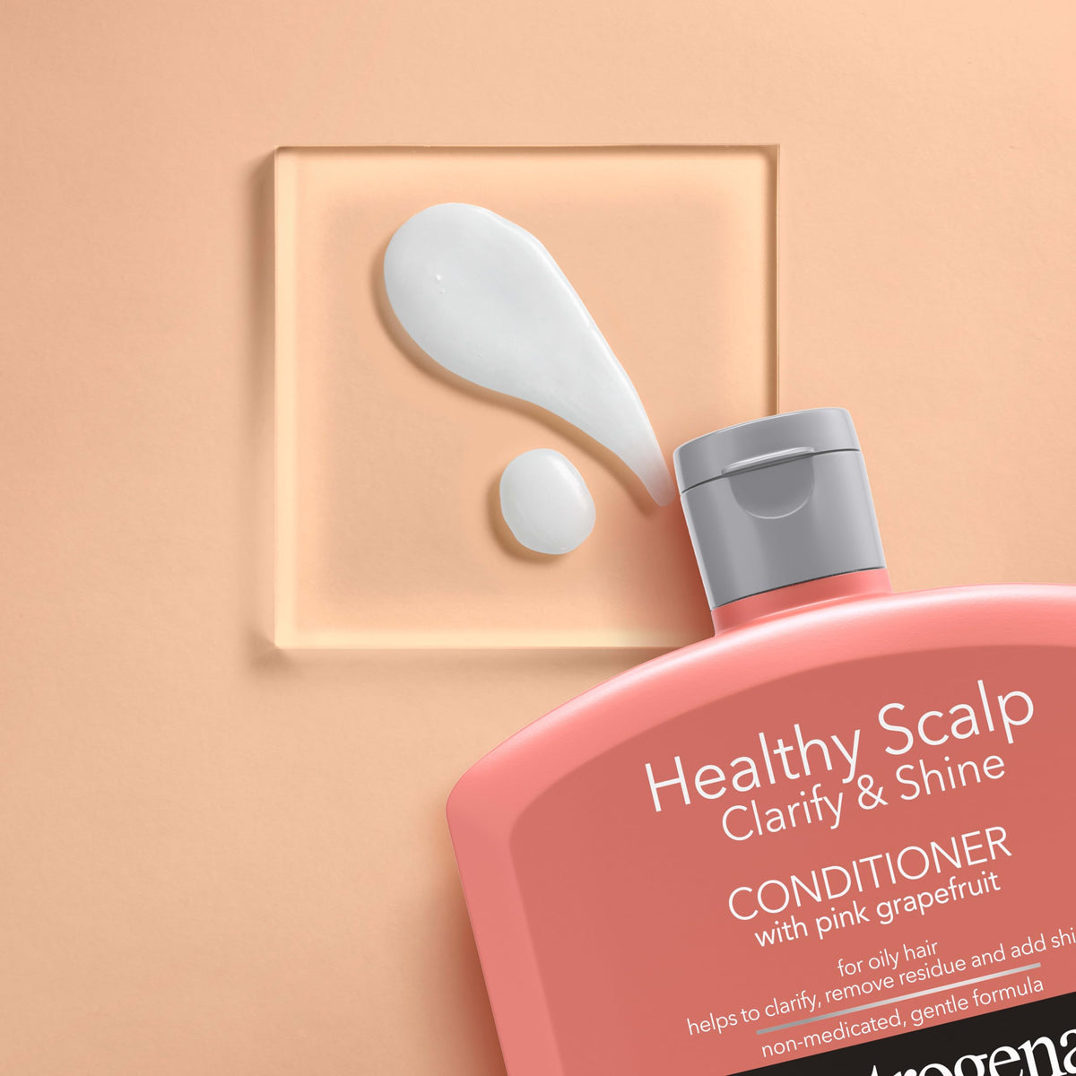 Neutrogena 12 fl oz bottle in hand showing true size benefit