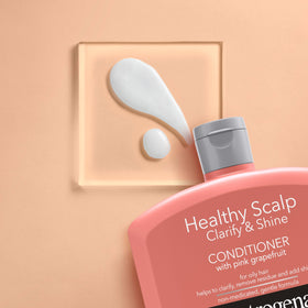 Neutrogena 12 fl oz bottle in hand showing true size benefit