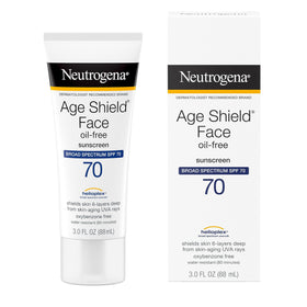 Applying Neutrogena Age Shield to face demonstrating smooth, non‑greasy finish