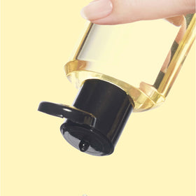 Neutrogena applying oil to damp leg to lock in moisture and soften skin