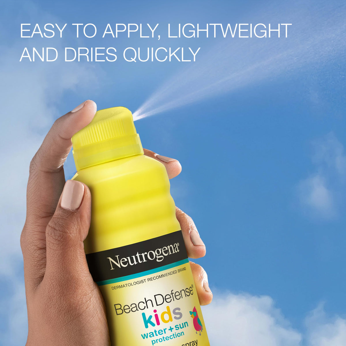 Neutrogena Beach Defense spray in action applied to child’s arm offering quick coverage