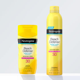 Neutrogena 8.5 oz can next to sunglasses and towel for scale