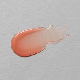 Neutrogena tube next to keys to show compact 0.35 oz size and portability