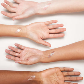 Neutrogena Purescreen+ bottle in a daily bag lifestyle scene for on-the-go protection