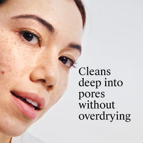 Neutrogena pad being wiped across cheek to remove oil and reduce pimples