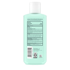 Hand holding Neutrogena 8 fl oz bottle illustrating scale and travel-friendly size