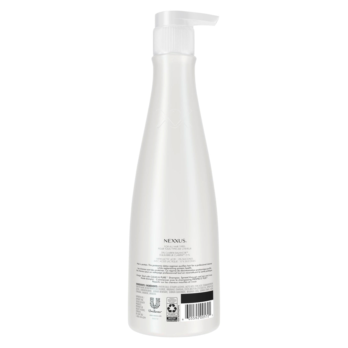 Nexxus 13.5 oz conditioner next to hand showing scale and travel convenience