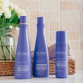 Model styling hair after using Nexxus HY-VOLUME for fuller, bouncy results
