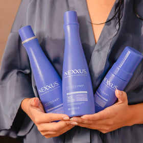Nexxus product trio size comparison showing 13.5 fl oz and 5.5 fl oz bottles