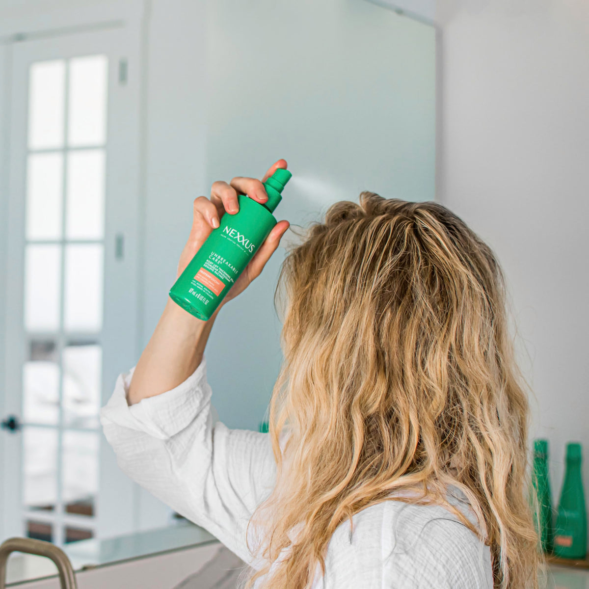 Nexxus spray on vanity showing salon-quality styling at home