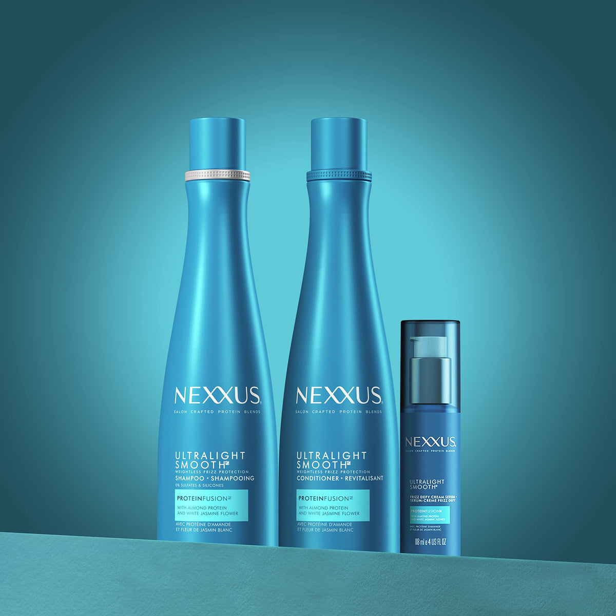 Nexxus bottles beside ruler showing 13.5 oz size and travel reference