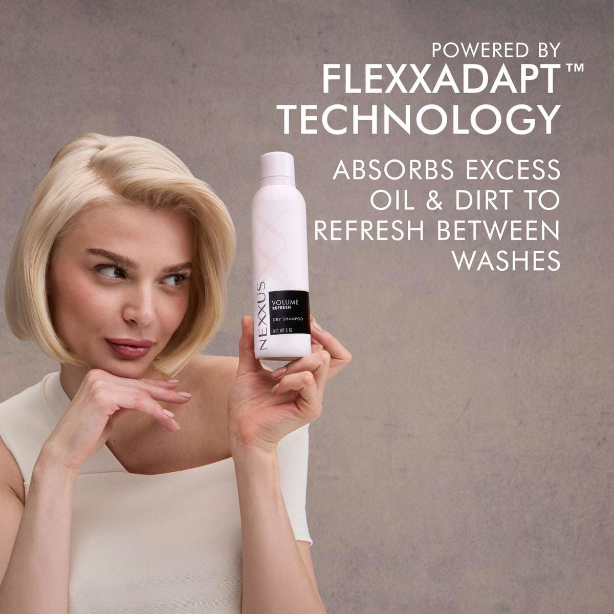 Nexxus can held in hand to show 5 oz size and travel-friendly benefit