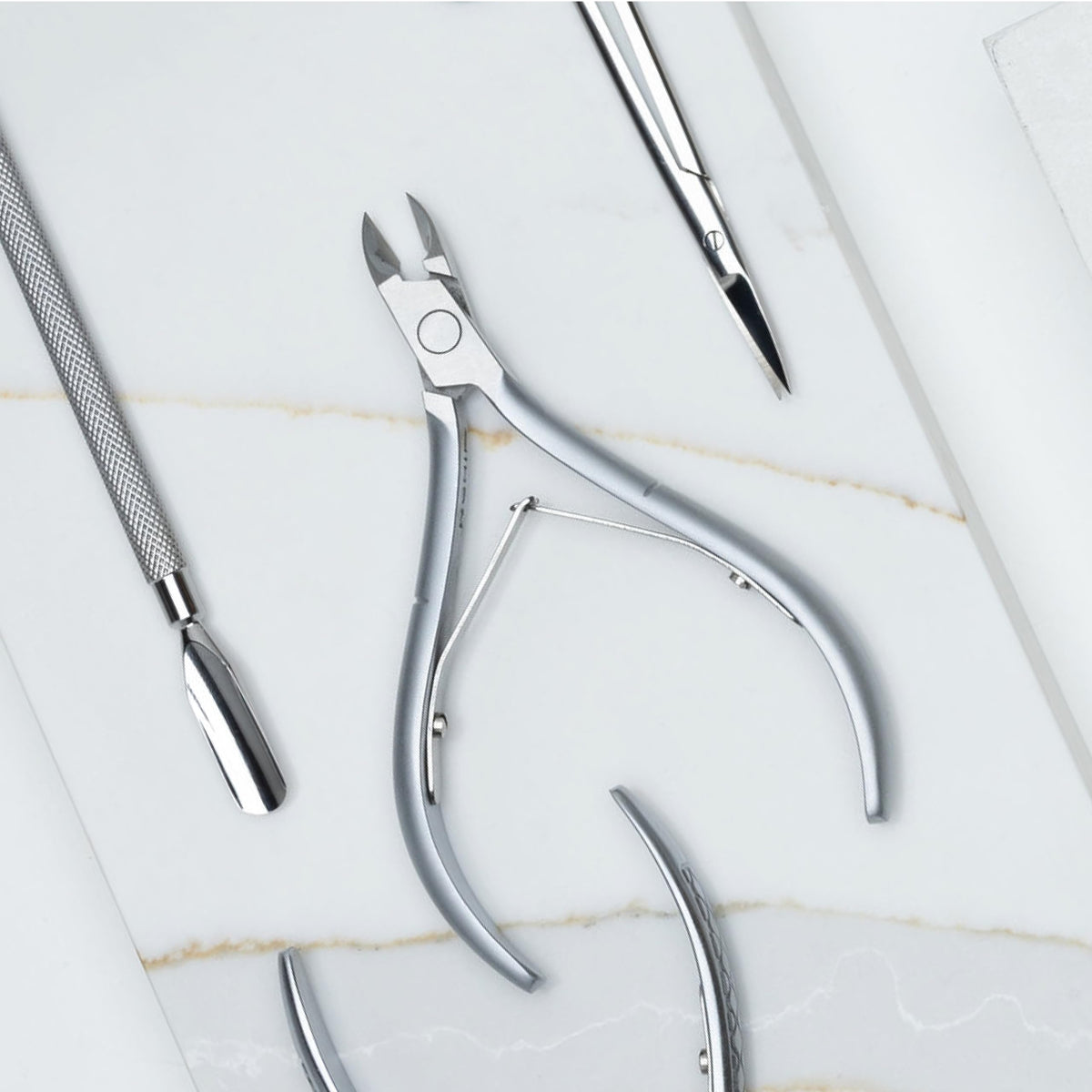 Nghia cuticle nipper beside ruler showing compact size and travel-friendly scale