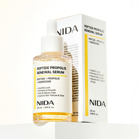 NIDA bottle staged on vanity to suggest daily skincare routine and brightening effect