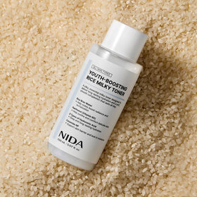 NIDA product being patted into skin, demonstrating quick absorption benefit