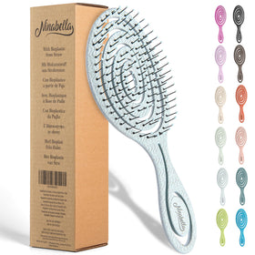 Ninabella front view of blue detangle brush showing ergonomic handle and head benefit comfort