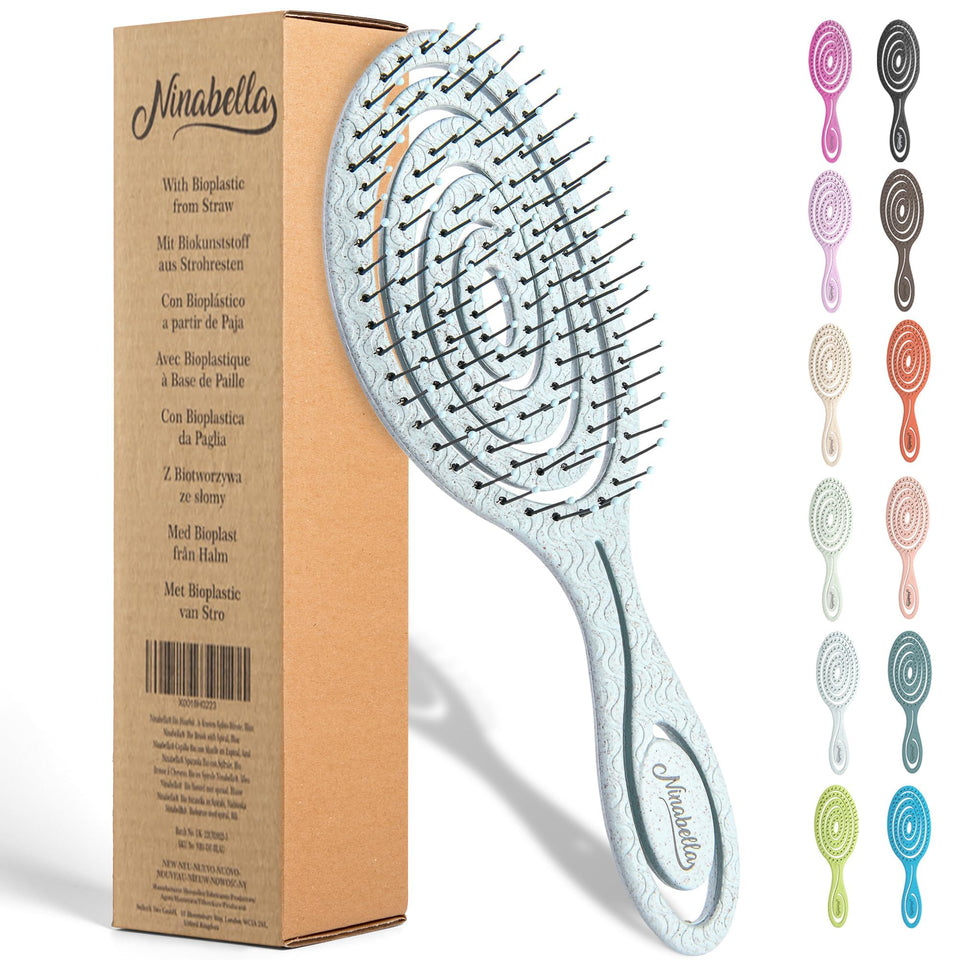 Ninabella front view of blue detangle brush showing ergonomic handle and head benefit comfort